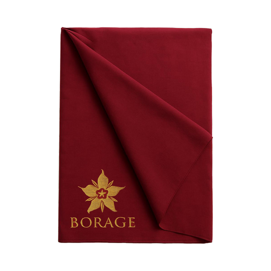 Folded red blanket with gold 'Borage' logo on a white background