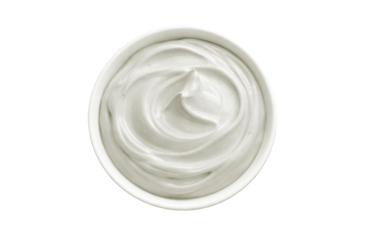 White cream in a small container on a white background