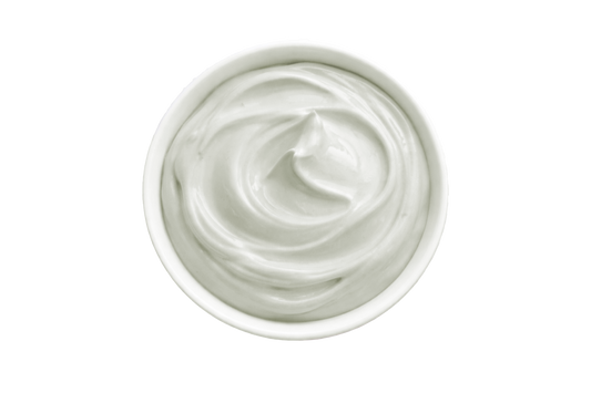 White cream in a small container on a white background