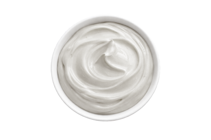 White cream in a small container on a white background