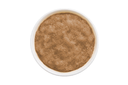 Brown scrub in a white container on a white background