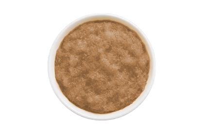 Brown scrub in a white container on a white background