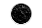 Dark scrub in a white bowl on a white background