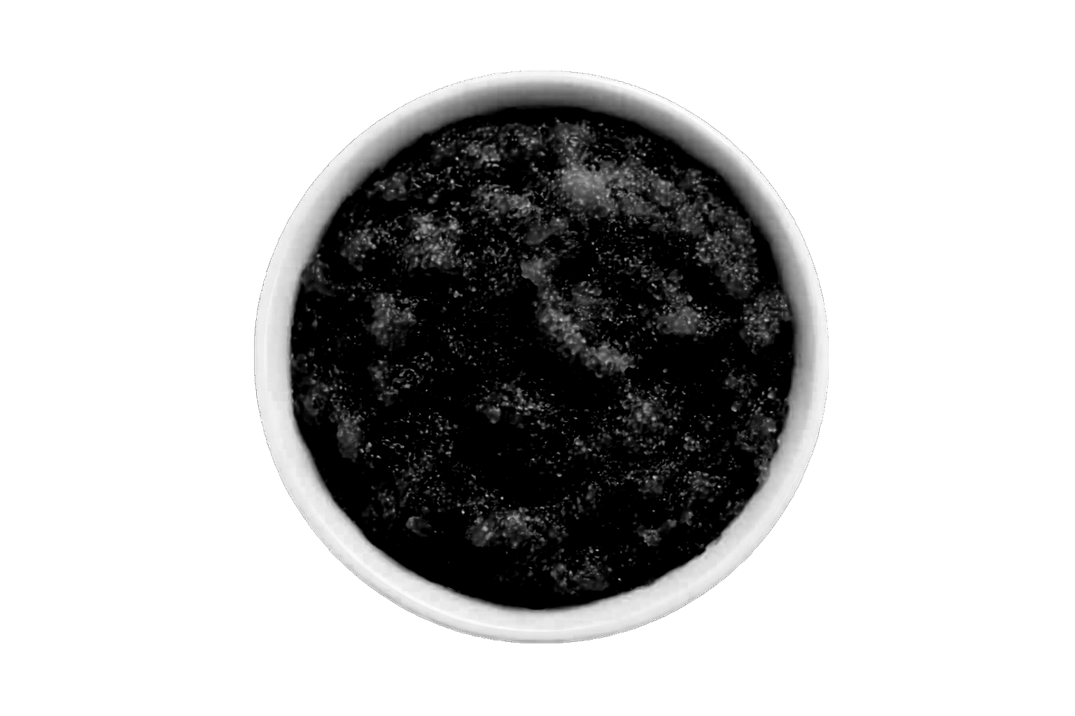 Dark scrub in a white bowl on a white background