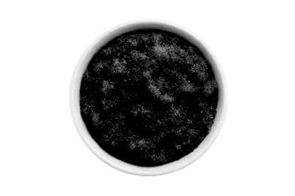 Dark scrub in a white bowl on a white background