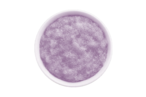Purple scrub in a white bowl on a white background