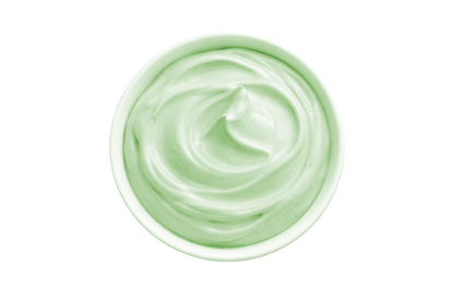 White cream in a small container on a white background