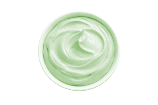 White cream in a small container on a white background