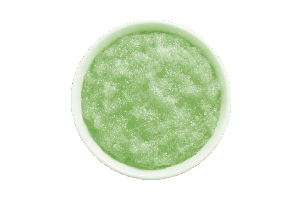 Green smoothie in a white bowl on a white background