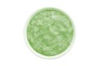 Green smoothie in a white bowl on a white background