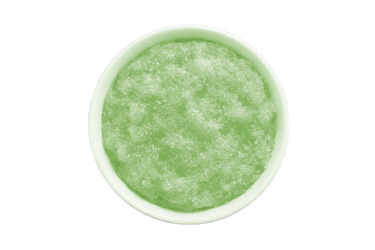 Green smoothie in a white bowl on a white background