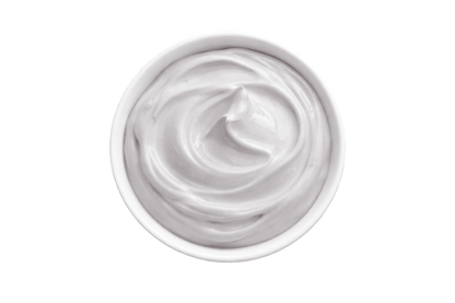 White cream in a small container on a white background