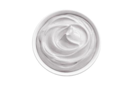 White cream in a small container on a white background