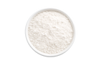 White powder in a bowl on a white background