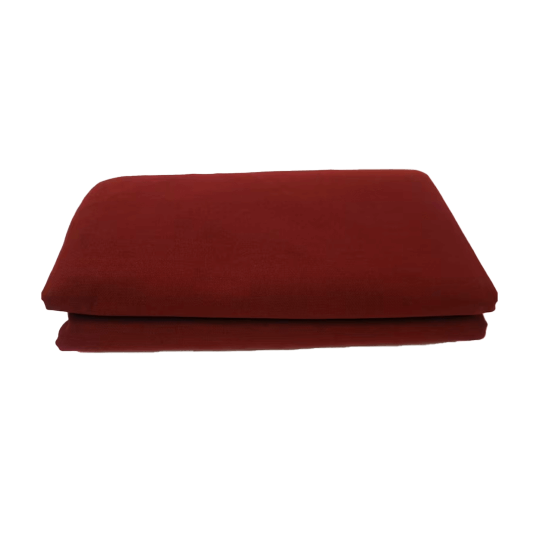 Folded red blanket on a white background
