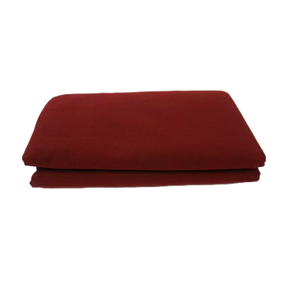 Folded red blanket on a white background