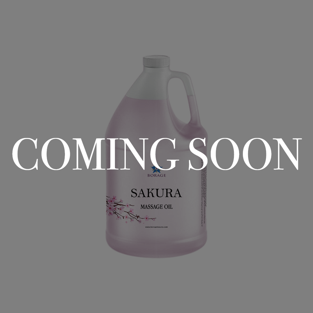 A large plastic jug of Sakura Massage Oil by BioRange on a solid gray background, overlaid with a large white 'COMING SOON' text banner.