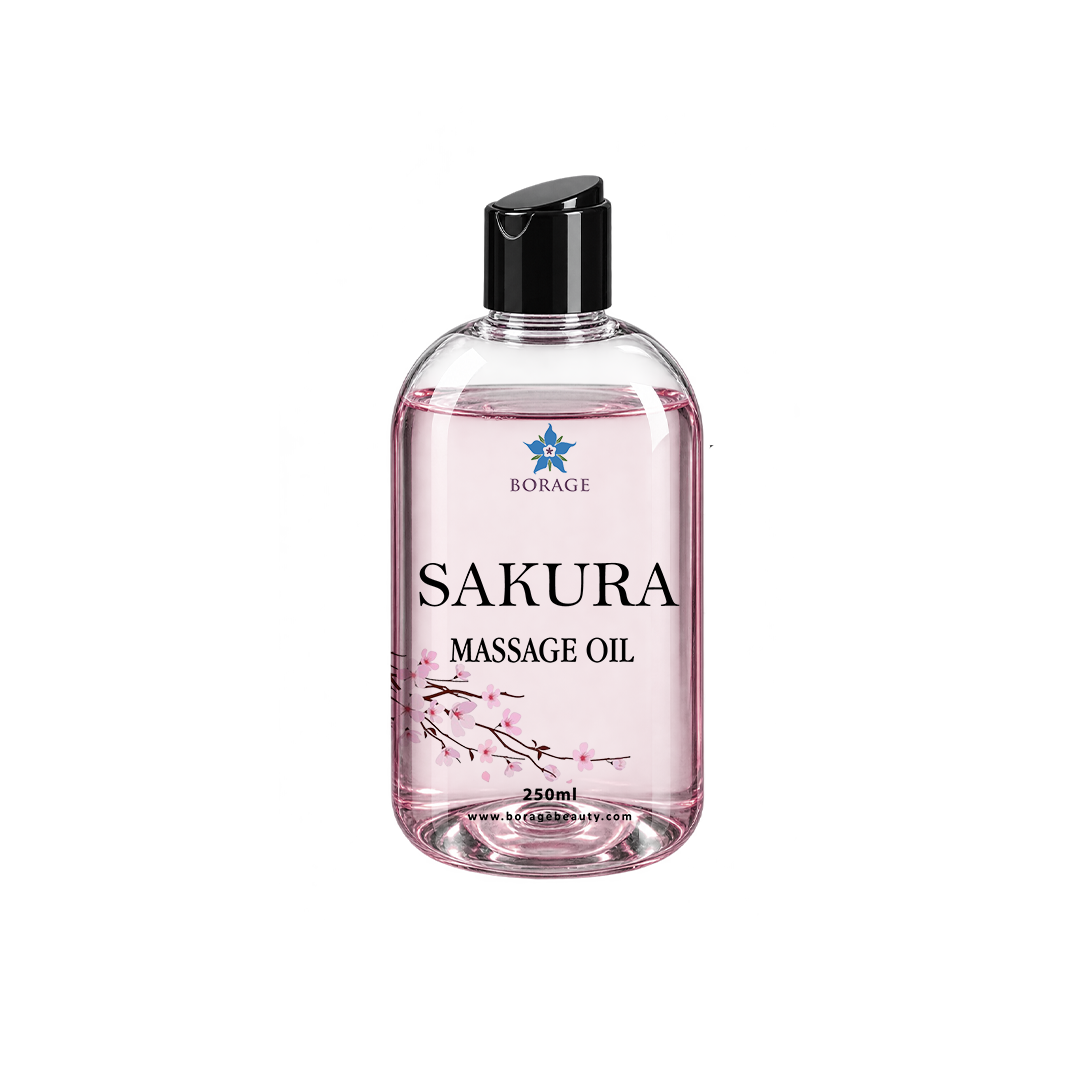 A bottle of BORAGE Sakura Massage Oil with a black flip-top cap, featuring a clear bottle filled with pink liquid and decorated with cherry blossom graphics on a white background.