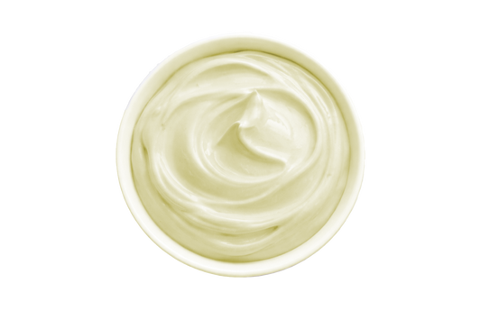 White cream in a small container on a white background