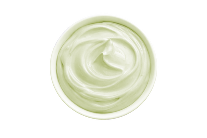White cream in a small container on a white background