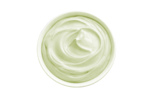 White cream in a small container on a white background