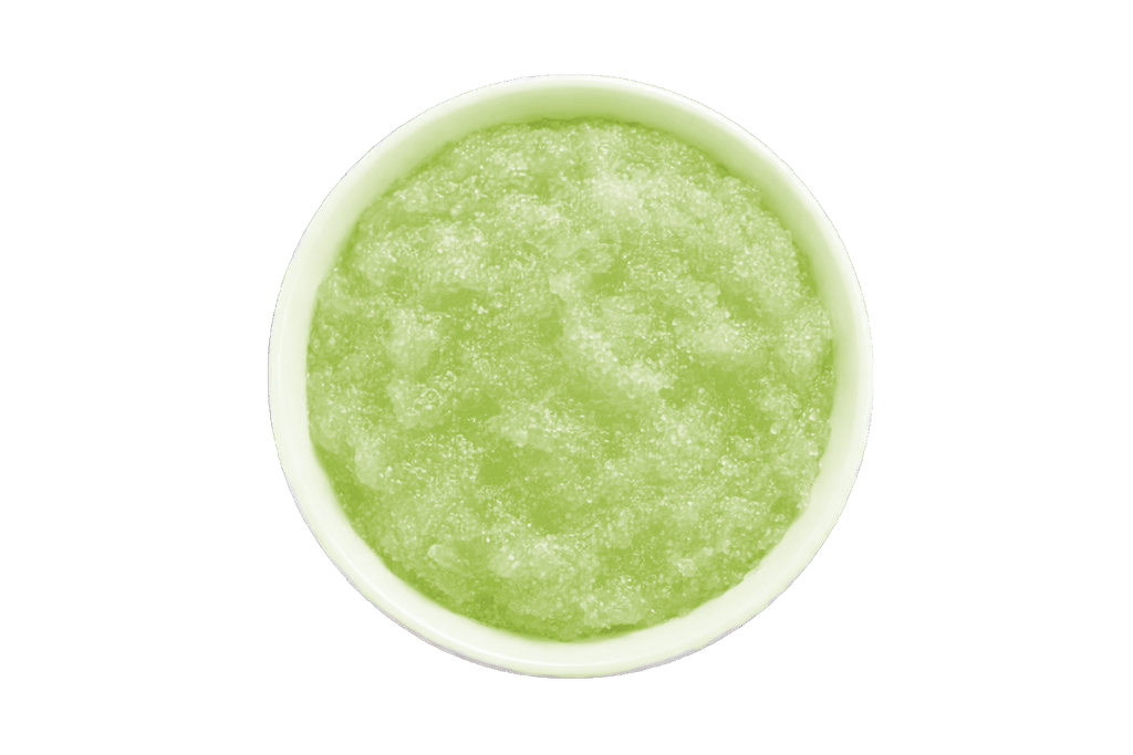 Green smoothie in a white bowl on a white background