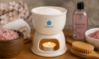 BORAGE Sakura Massage Heater with Sakura Massage Oil in spa treatment setting